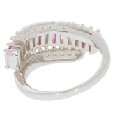 Side view of an Emerald Pink Sapphire Sterling Silver Ring showcasing its elegant design and sparkling gemstones.
